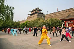 Playing Taichi near Xian City Wall