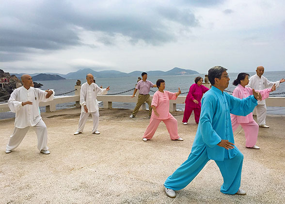 Practicing Tai Chi on the beach